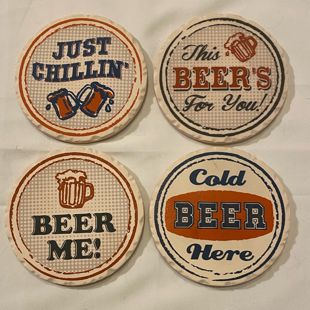 Set of 4 Absorbent stone coasters. Cork back to prevent scratching.